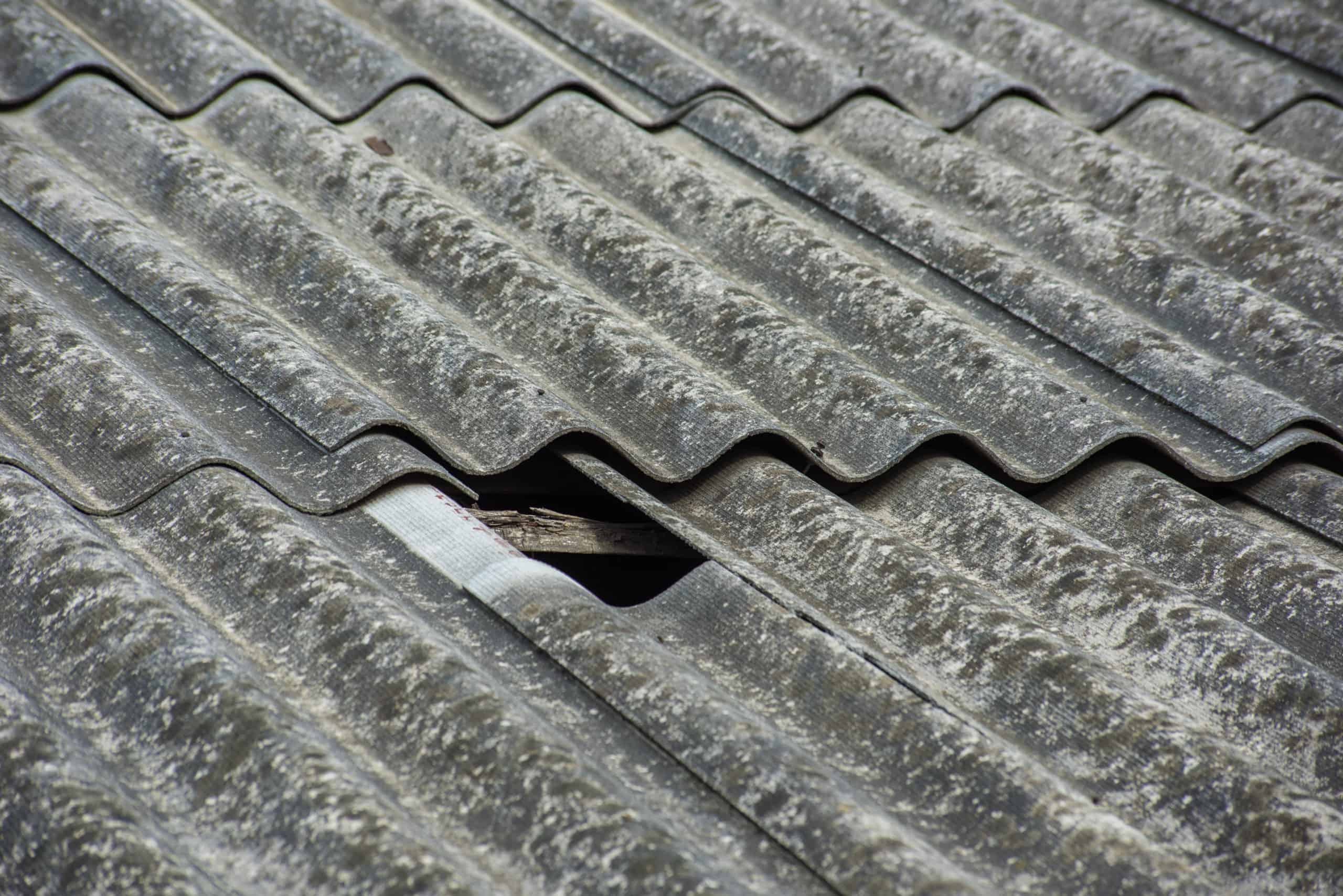 Slate texture on the roof with a broken hole